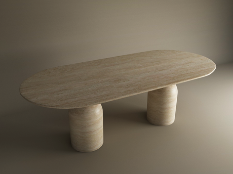 A top-down view of an oval, beige stone table with natural marbling, set against a neutral-colored background. The surface has subtle texture and warm tones.