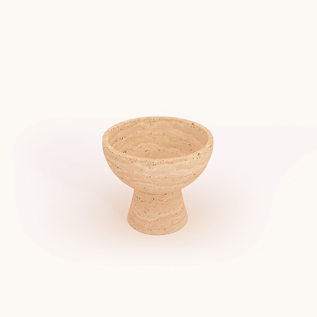 The Sleek Modern Travertine Marble Bowl by Travertable features a textured beige design with natural speckles, a wide rim, and thick base, set against a white background for a stone-like appearance.