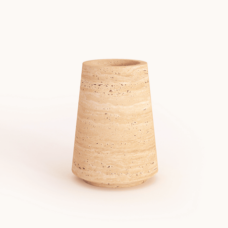 A Classic Beige Travertine Vase by Travertable, featuring a textured ceramic design with a wide base tapering slightly towards the top, set against a plain white background.