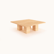 Pebble Path Travertine Coffee Table by Travertable features a fluid, freeform design with a unique stone finish against a plain white background.