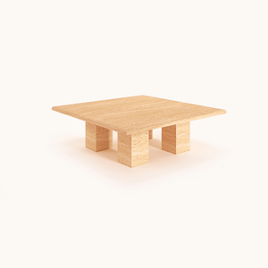 Pebble Path Travertine Coffee Table by Travertable features a fluid, freeform design with a unique stone finish against a plain white background.