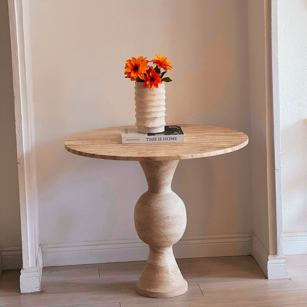 The Hourglass Round Travertine Dining Table