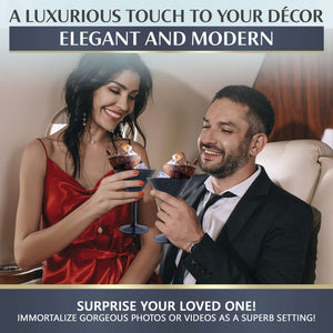 A couple clinks Mamaco Home Large Martini Glasses in an elegant setting. She wears a red dress, he dons a suit. A Luxurious Touch to Your Décor: Elegant and Modern, suggests surprising a loved one with these shatterproof, BPA-free tumblers for home or events.