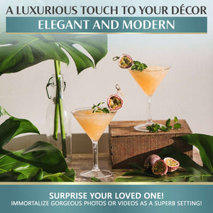 Mamaco Homes Large Martini Glasses, crafted from unbreakable polycarbonate, hold a peach drink garnished with passion fruit and mint. Surrounded by sprigs and leaves, this BPA-free setting is perfect for capturing photos or videos to surprise loved ones against luxurious decor.