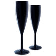 Against a white background, two Unbreakable Black Champagne Flutes by Mamaco Home, crafted from elegant polycarbonate and featuring crystal-clear clarity with droplets of condensation, stand upright.