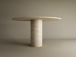 The TRAVERTABLE Oval Travertine Dining Table features a pure travertine stone oval top and a sturdy cylindrical center base—an elegant, customizable piece to transform your dining space.