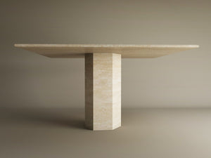 The TRAVERTABLE Square Travertine Dining Table features a customizable geometric design with a thick hexagonal center base, all in light natural stone—an instant heirloom for modern spaces.