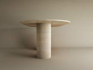 The TRAVERTABLE Oval Travertine Dining Table features a solid, light stone top and a fluted round base, both expertly crafted from natural travertine—an heirloom-quality centerpiece that’s customizable to your space.