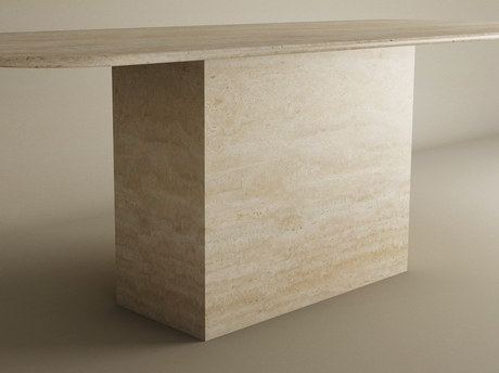 The TRAVERTABLE Rectangular Travertine Dining Table features a natural stone tabletop and block base, offering a timeless, customizable design that complements neutral spaces with its solid build and smooth surface.