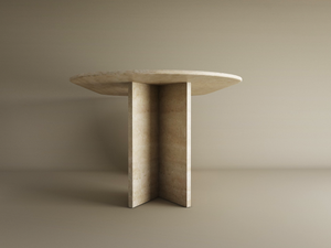 The TRAVERTABLE Oval Travertine Dining Table features a beige travertine stone top and a split-V pedestal base, creating an elegant, customizable centerpiece for minimalist, neutral-toned spaces.