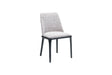 The Travertable Comfort Dining Chair is a sleek, modern dining chair featuring an ergonomic design with a cushioned seat and backrest upholstered in light gray fabric. Its minimalist aesthetic is highlighted by four slender black legs against a plain white background.