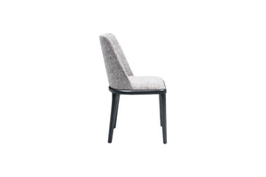 Side view of the Travertable Comfort Dining Chair, featuring a gray fabric seat and backrest with black metal legs. This chair showcases a minimalist, modern design and an ergonomic structure for maximum comfort.