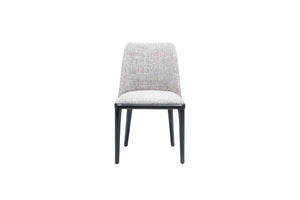 Introducing Travertables Comfort Dining Chair, boasting a modern design with a softly cushioned light gray fabric seat and backrest. Supported by four slender black legs, its ergonomic structure is highlighted against a white background for minimalist elegance.