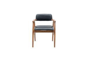 Travertables Executive Elegance Armchair features sleek faux leather upholstery. With a minimalist design, wooden frame, and ergonomic armrests, its black cushioned seat and backrest create a stunning blend of comfort and style against a white backdrop.