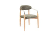The Orion Designer Chair by Travertable features a modern design with a green cushioned backrest and seat, supported by light wood legs. Its metallic armrests curve outward slightly, offering ergonomic comfort while maintaining a sleek, contemporary look.